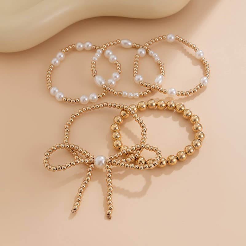 JOSSLYN by Wall to Wall Gold Multi Layer Pearl Bow Bracelet