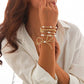 JOSSLYN by Wall to Wall Gold Multi Layer Pearl Bow Bracelet