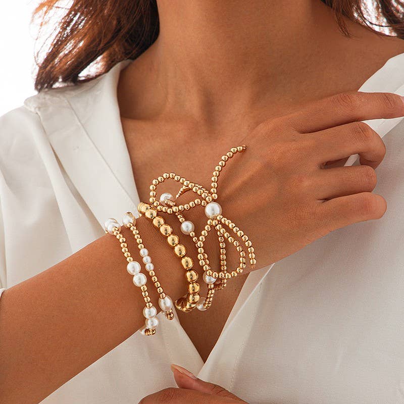 JOSSLYN by Wall to Wall Gold Multi Layer Pearl Bow Bracelet